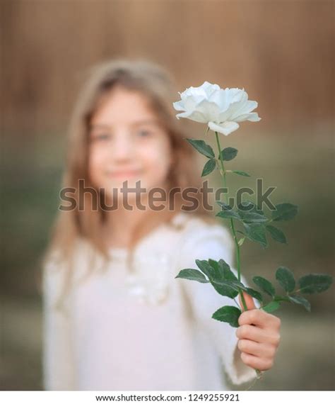Happy Adorable Little Girl Holding Flower Stock Photo 1249255921