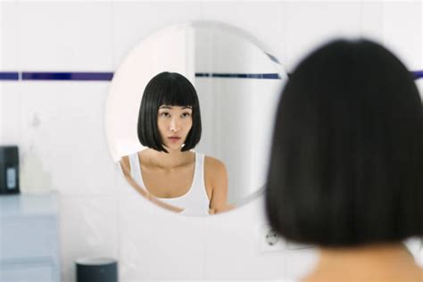 Royalty Free Woman Looking In Mirror Pictures Images And Stock Photos