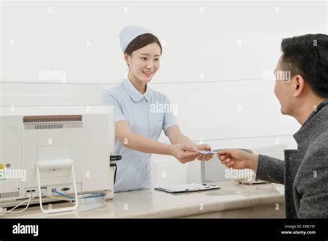 The Patient Is At The Cashiers Desk Stock Photo Alamy