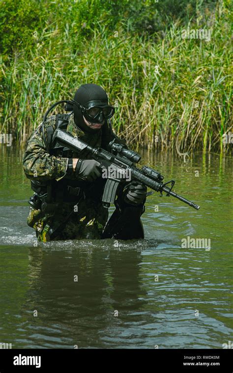 Frogman With Complete Diving Gear And Weapons In The Water Stock Photo Alamy