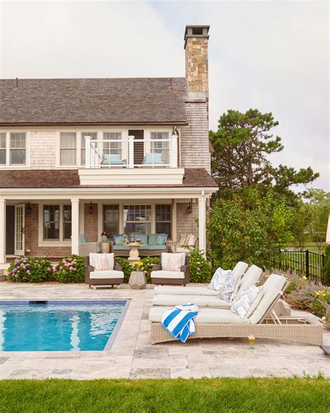 This homall set includes two chaise lounges and a side table. Poolside Lounge Chairs and Porch | HGTV