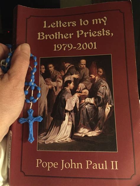 A Hand Holding A Book With A Blue Cross On It And The Title Letters To
