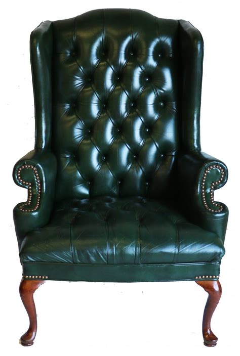 Leather is a traditional option for wing back chairs due to its durability. Green Leather Tufted Wing Back Chair