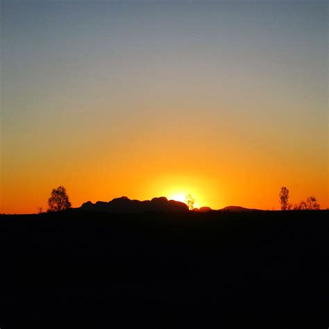 Sun Setting Behind Kata Tjuta At Sounds Of Silence Uluru Redcentre