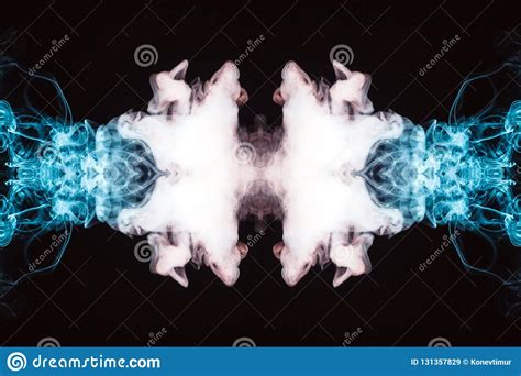 Abstract Thick Colored Smoke On A Black Background With A Monster Face