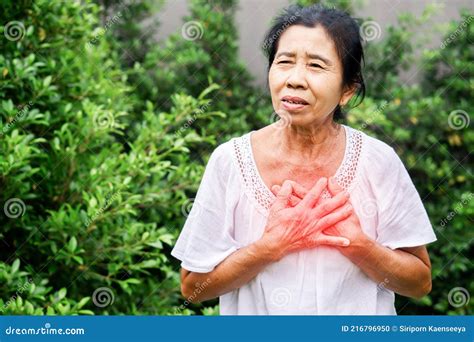 Senior Asian Woman Suffering From Heartburn Chest Pain Difficult To