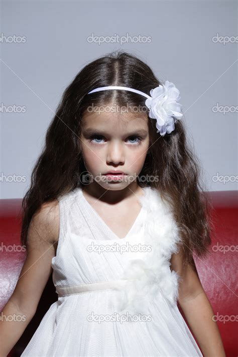 Portrait Of Young Beautiful Little Girl With Dark Hair Stock Photo By