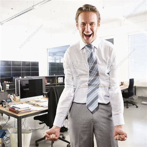 Businessman Tied Up In Office Stock Image F0057672 Science Photo