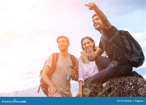 Group Of Friends Hiking Together Through The Forest Stock Image Image
