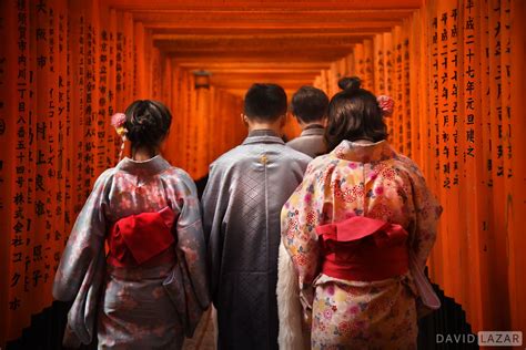 Friends Walking Through Red Torii Gates Kyoto