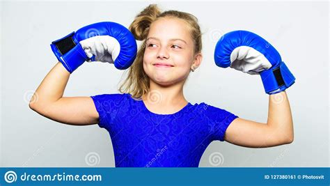 Kid Strong And Healthy. Girl Child Strong With Boxing Gloves Posing On Grey Background. She ...