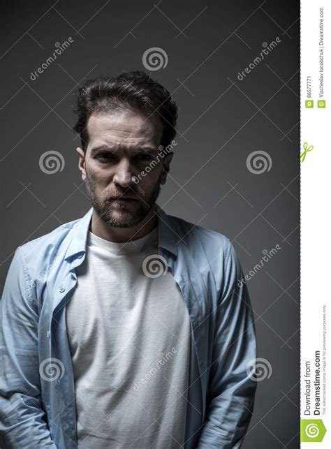 Portrait Of Angry Man Standing Over Grey Background Stock Image Image