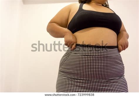 Overweight Woman Trying Fasten Her Skirt Stock Photo 723999838