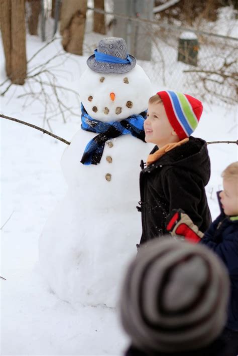 Kids With Snowman Raising Roberts