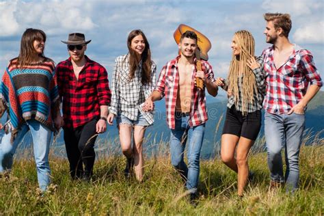Group Of Friends Hikers Walking In Mountains Young Men And Women On