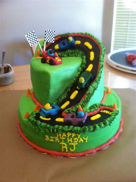 If you have a toddler at home ready to dive into art exploration, let me be your guide. Race Track Cake - Cake made for 2 year old boy. Client asked for NO Fondant! So, cars and cones ...