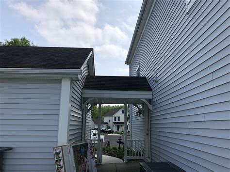 Extending Front Porch Installing Matte Black Standing Seam Metal Roof