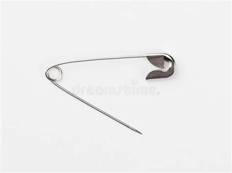 Set Of Metal Pins For Clothing Isolate On A White Background Stock