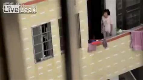 Mother In China Caught On Camera Dangling Son Over Edge Of Balcony As