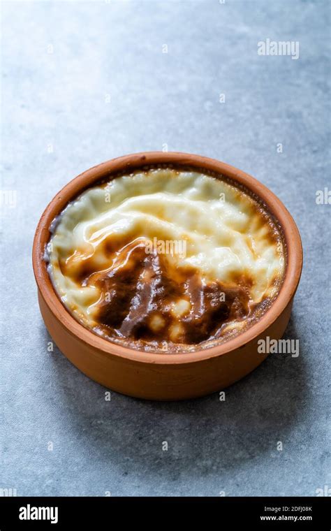 Turkish Dessert Sutlac Baked Rice Pudding Custard In Casserole Pot Ready To Serve And Eat Stock