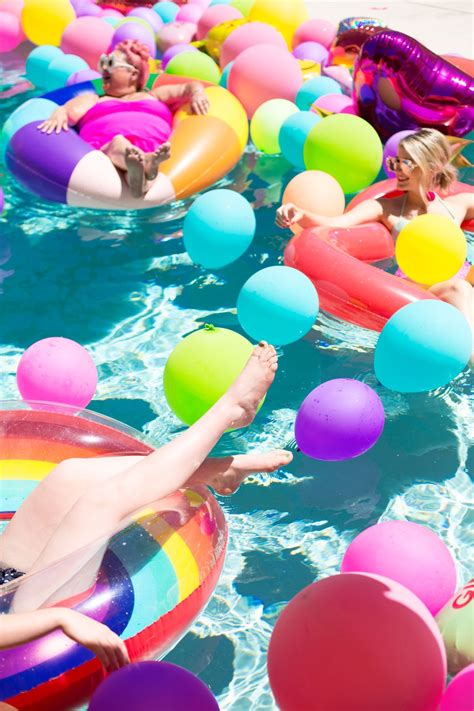 An Epic Rainbow Balloon Pool Party Pool Party Themes Mermaid Pool Parties Neon Pool Parties
