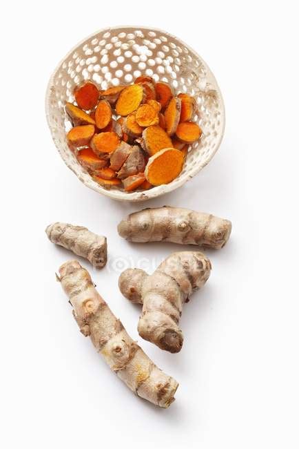 Whole And Sliced Turmeric Roots Eco Unprocessed Stock Photo