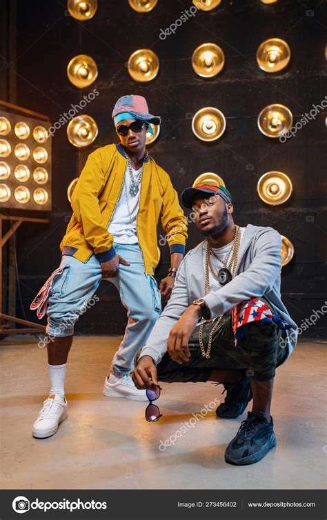 Two African Rappers Caps Artists Posing Stage Spotlights Background Rap
