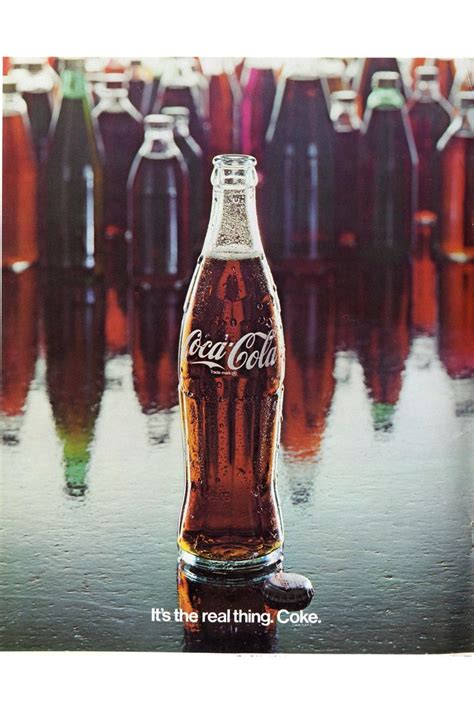 An Advertisement For Coca Cola Is Shown In Front Of Many Empty Coke