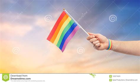 Hand With Gay Pride Rainbow Flag And Wristband Stock Image Image Of Rainbow Alternative