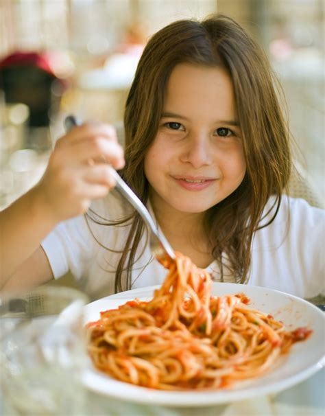 Young Girl Eating Spaghetti In Restaurent Alpha Hotel Canberra