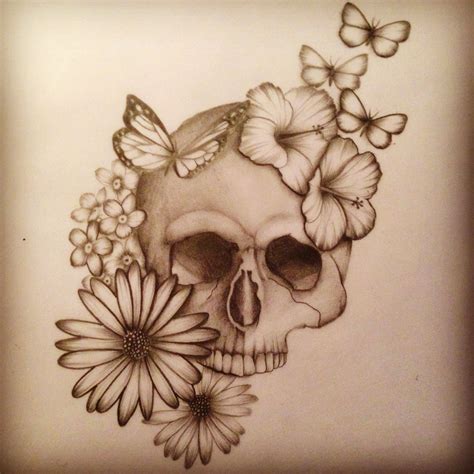 a drawing of a skull with flowers and butterflies on it's head is shown