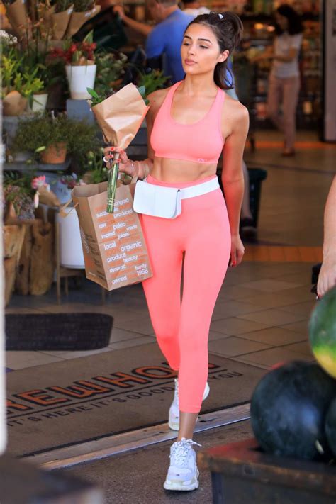 Olivia Culpo Shows Off Her Toned Abs In Her Pink Workout Gear While Grocery Shopping At Erewhon