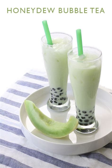 Two Glasses Filled With Green Liquid Sitting On Top Of A White Plate