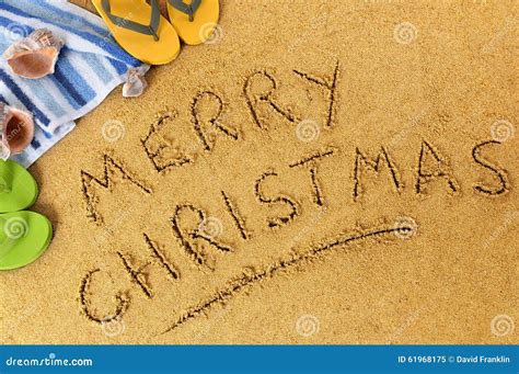 Merry Christmas Message Written In Sand On A Sunny Tropical Beach