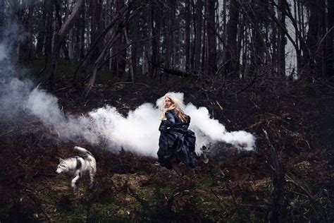 Haunting Fantasy Of A Woman Running With Wolves In A Forest