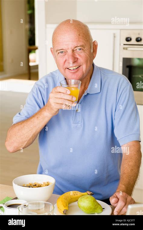 Portrait Of Man Eating Breakfast Stock Photo Alamy