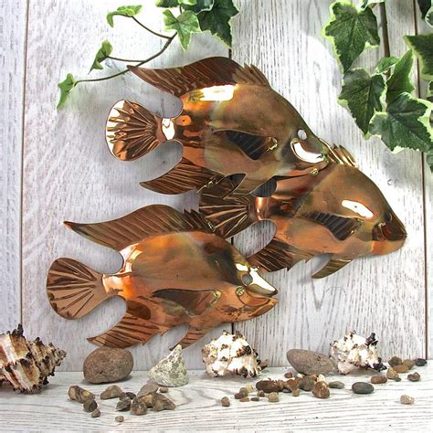 The tile can be used in any room with your wall tile arrangement to provide an. copper fish trio garden wall art sculpture by london garden trading | notonthehighstreet.com