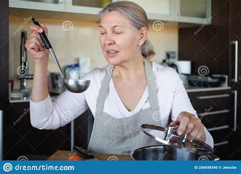 Mature Woman In Kitchen Preparing Food Stock Photo Image Of Fresh
