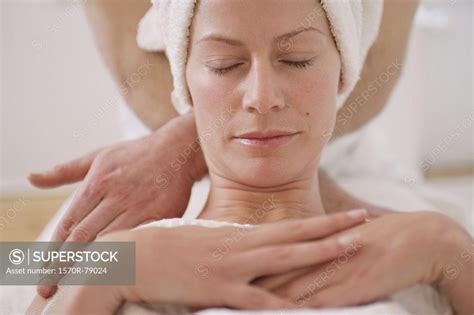 A Massage Therapist Massaging A Womans Neck Superstock