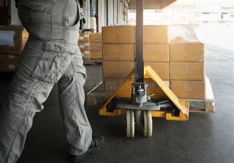 Cargo Boxes Shipment Worker Working With Electric Forklift Pallet Jack Unloading Cardboard