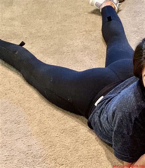 Girl Lying On Her Stomach On The Floor In Tights With