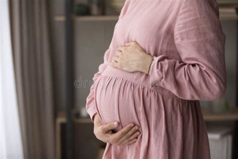 Unknown Pregnant Woman Standing Indoor Touch Her Big Belly Stock Image Image Of Feelings Home
