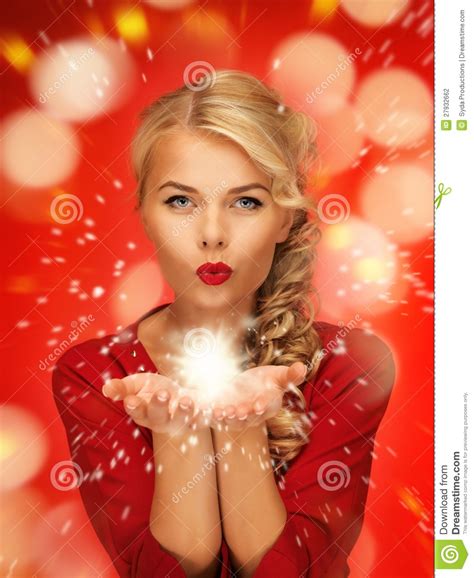 Woman Blowing Magic On The Palms Of Her Hands Stock Photo Image Of