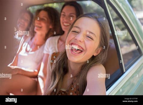 Four Women Playing In Car Backseat Stock Photo Alamy