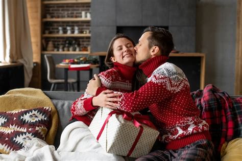 Premium Photo Couple Giving Each Other Christmas Ts