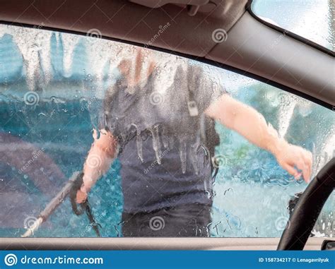 Most of them also have a nice brush that people use to clean the. Man Washing Car With Foam And Hose At A Do It Yourself Car Wash Stock Image - Image of grime ...