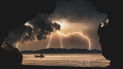 2560x1440 Landscape Storm Rays Sea Clouds Cave Fantasy 8k