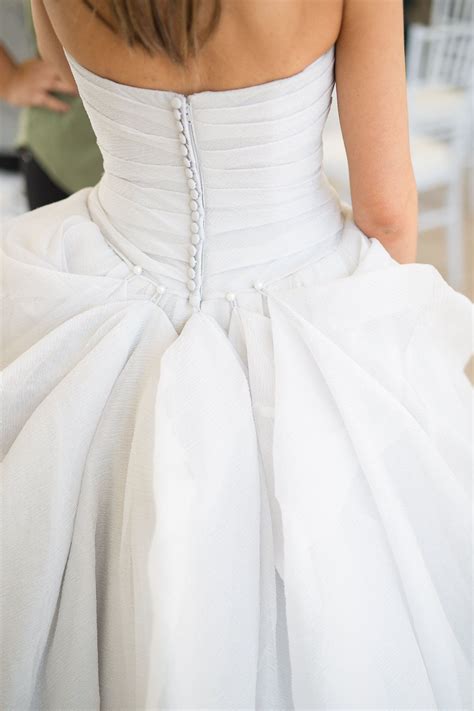 The Back Of A Womans White Wedding Dress