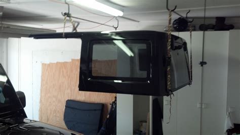 This is both a diy and demonstration video of making a lift (or hoist) to remove and store your jeep tj (wrangler) hard top.this is a very simple system that can easily be made with the following:1. DIY hardtop hoist idea - Jeep Wrangler Forum