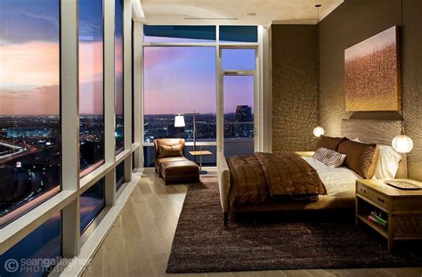 Bedroom Of A Luxury High Rise Condominium Overlooks City And A Colorful